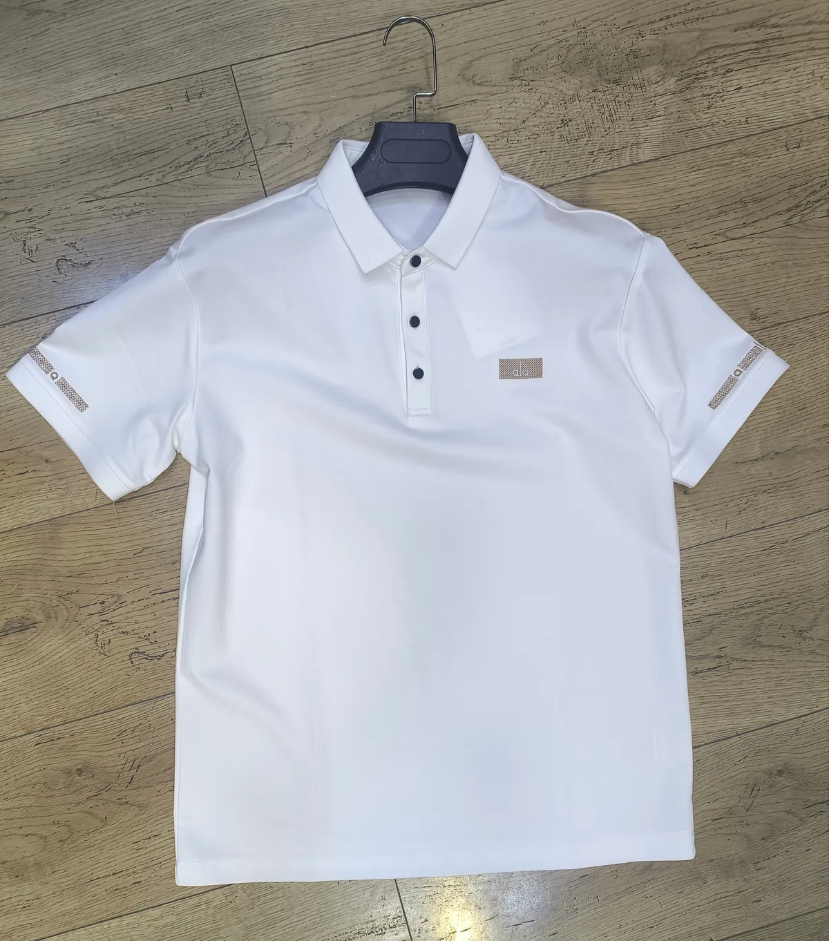 Classic White Polo Shirt With Decorative Sleeve Bands And Logo